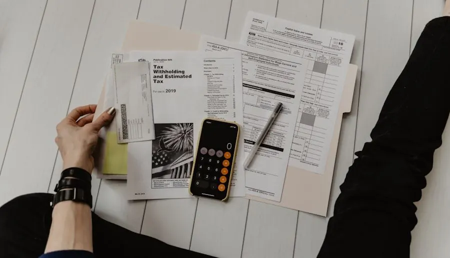 A calculator and finance paperwork laid out on a desk